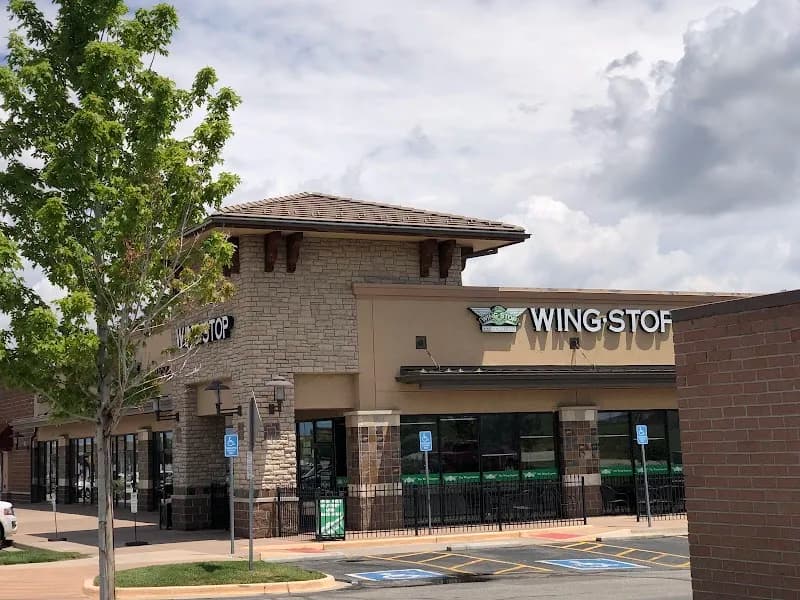 Wingstop storefront outside and inside view at 6140 S Gun Club Rd in Aurora, Colorado