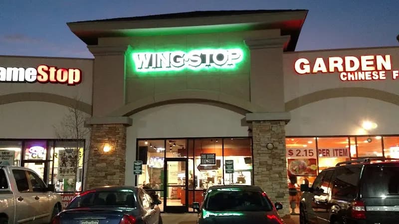 Wingstop storefront outside and inside view at 1580 Space Center Dr in Colorado Springs, Colorado