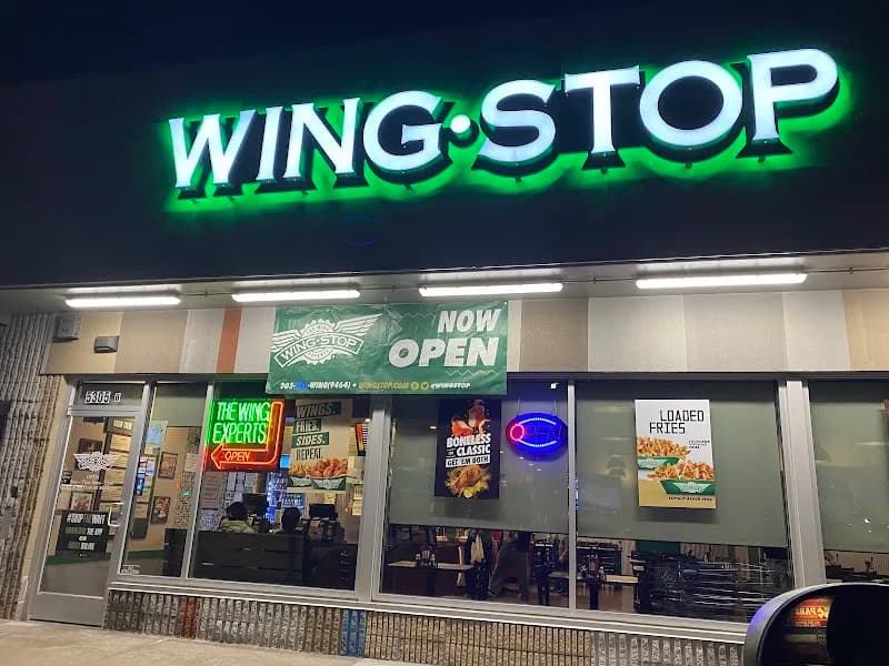 Wingstop storefront outside and inside view at 5305 E. Colfax Ave in Denver, Colorado