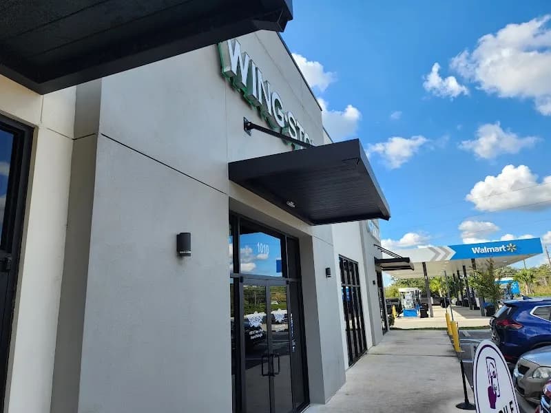 Wingstop storefront outside and inside view at 3002 SR 436 in Apopka, Florida