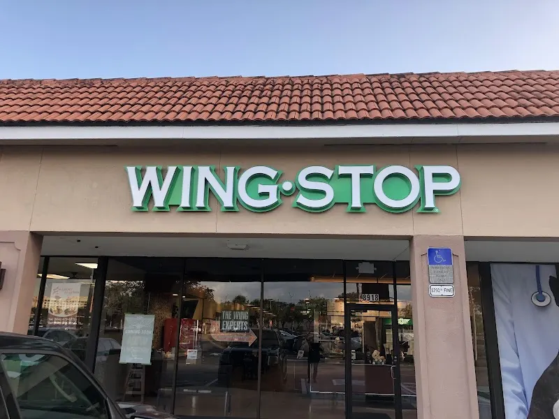 Wingstop storefront outside and inside view at 8918 W State Road 84 Unit E12 in Davie, Florida