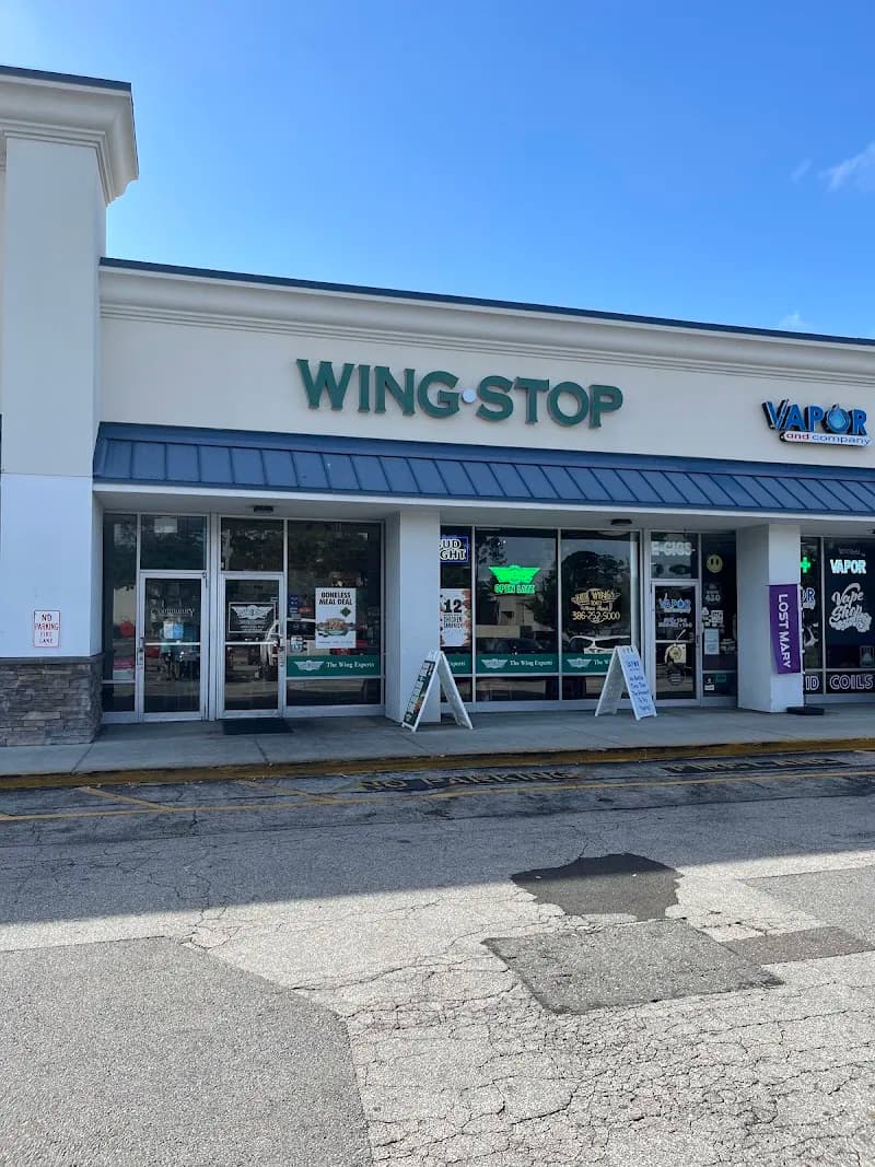 Wingstop storefront outside and inside view at 1344 W International Speedway Blvd in Daytona Beach, Florida