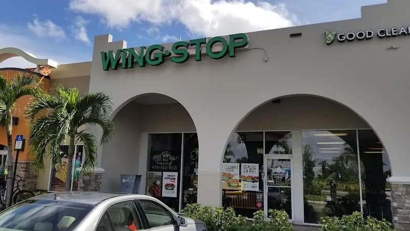 Wingstop storefront outside and inside view at 3656 W Hillsboro Blvd Ste A in Deerfield Beach, Florida