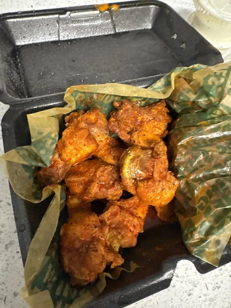 Wingstop storefront outside and inside view at 18911 S Tamiami Trail Suite 6 in Fort Myers, Florida