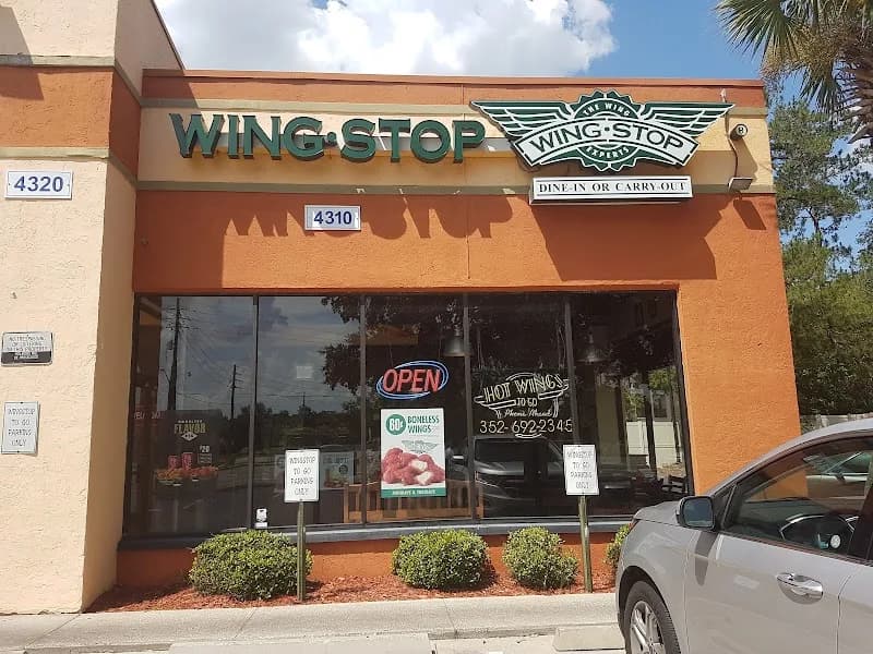 Wingstop storefront outside and inside view at 2024 SW 34th St in Gainesville, Florida
