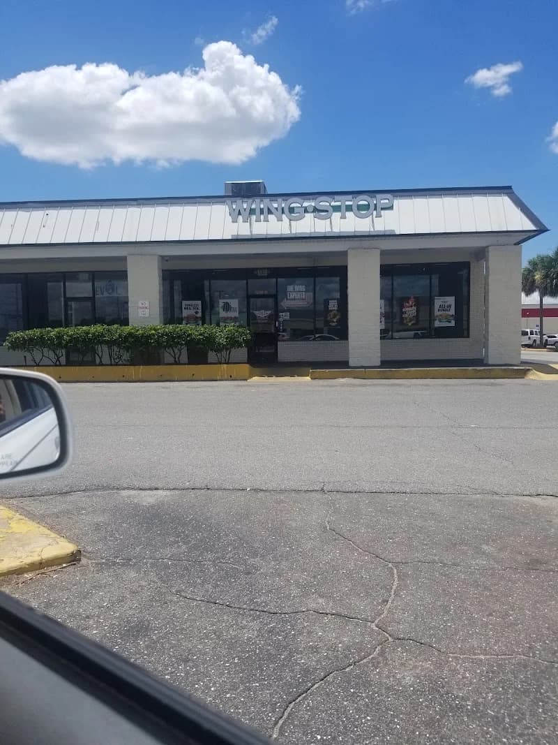 Wingstop storefront outside and inside view at 5290-10 Norwood Avenue in Jacksonville, Florida