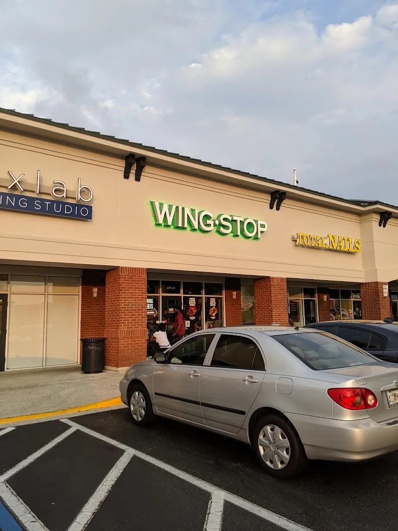 Wingstop storefront outside and inside view at 4375 Southside Blvd #12 in Jacksonville, Florida