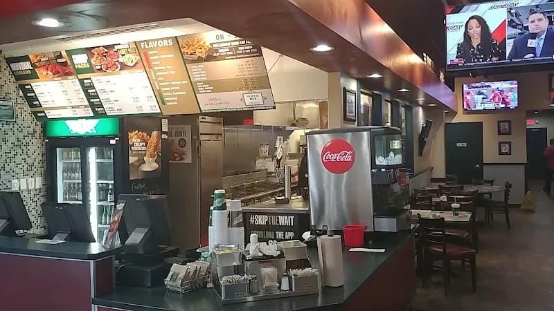 Wingstop storefront outside and inside view at 5324 Blanding Blvd in Jacksonville, Florida