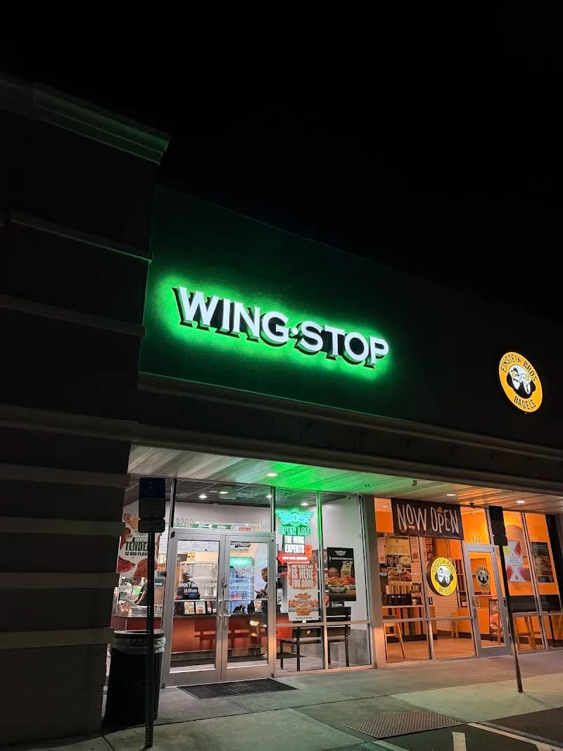 Wingstop storefront outside and inside view at 3260 Vineland Rd in Kissimmee, Florida