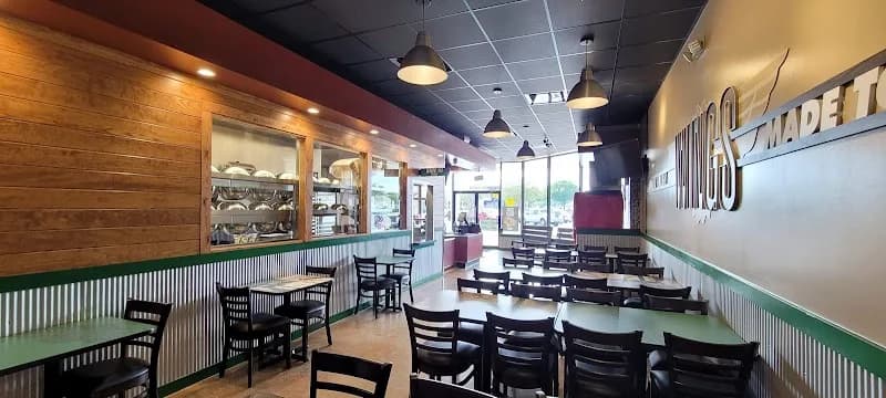 Wingstop storefront outside and inside view at 23044 SR 54 in Lutz, Florida