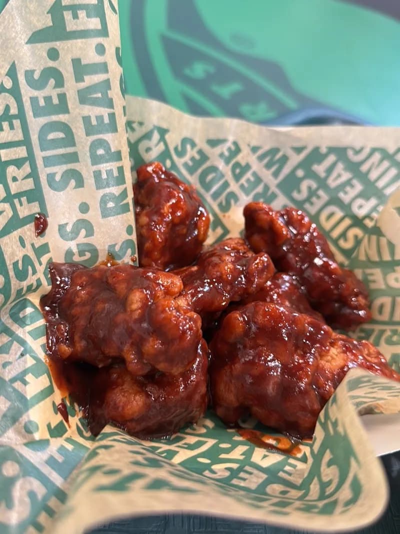 Wingstop storefront outside and inside view at 10961 SW 40th St in Miami, Florida