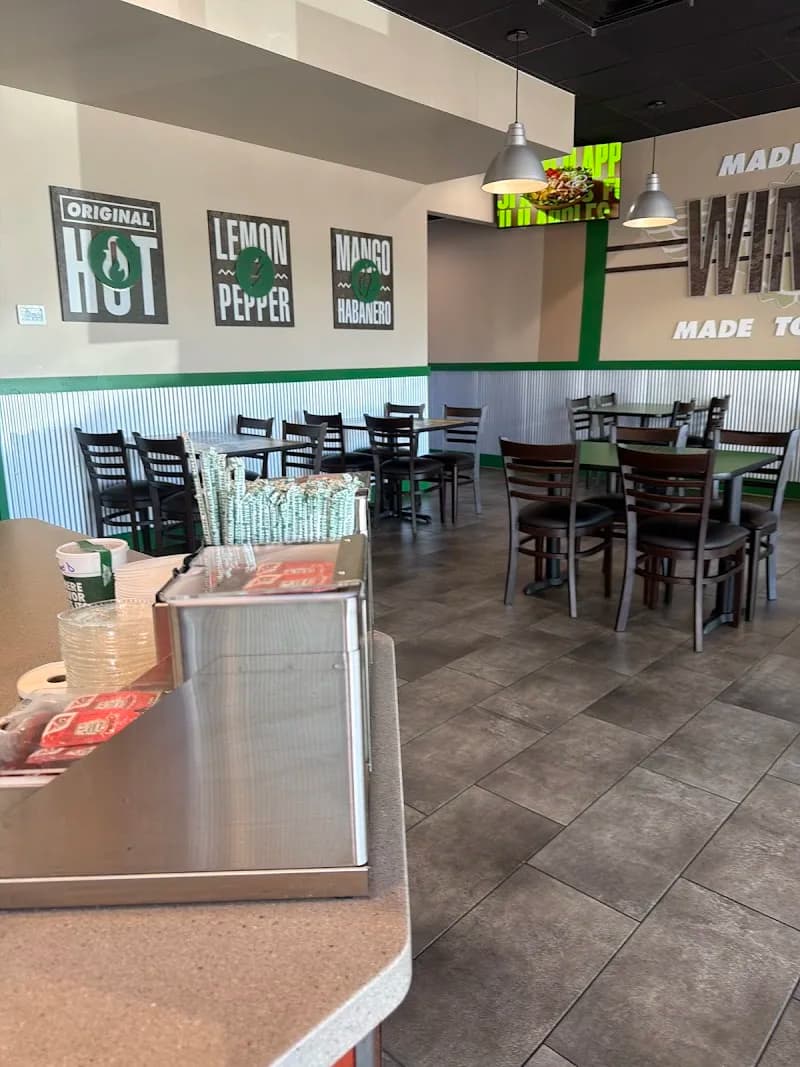 Wingstop storefront outside and inside view at 805 NW 119th St. in Miami, Florida