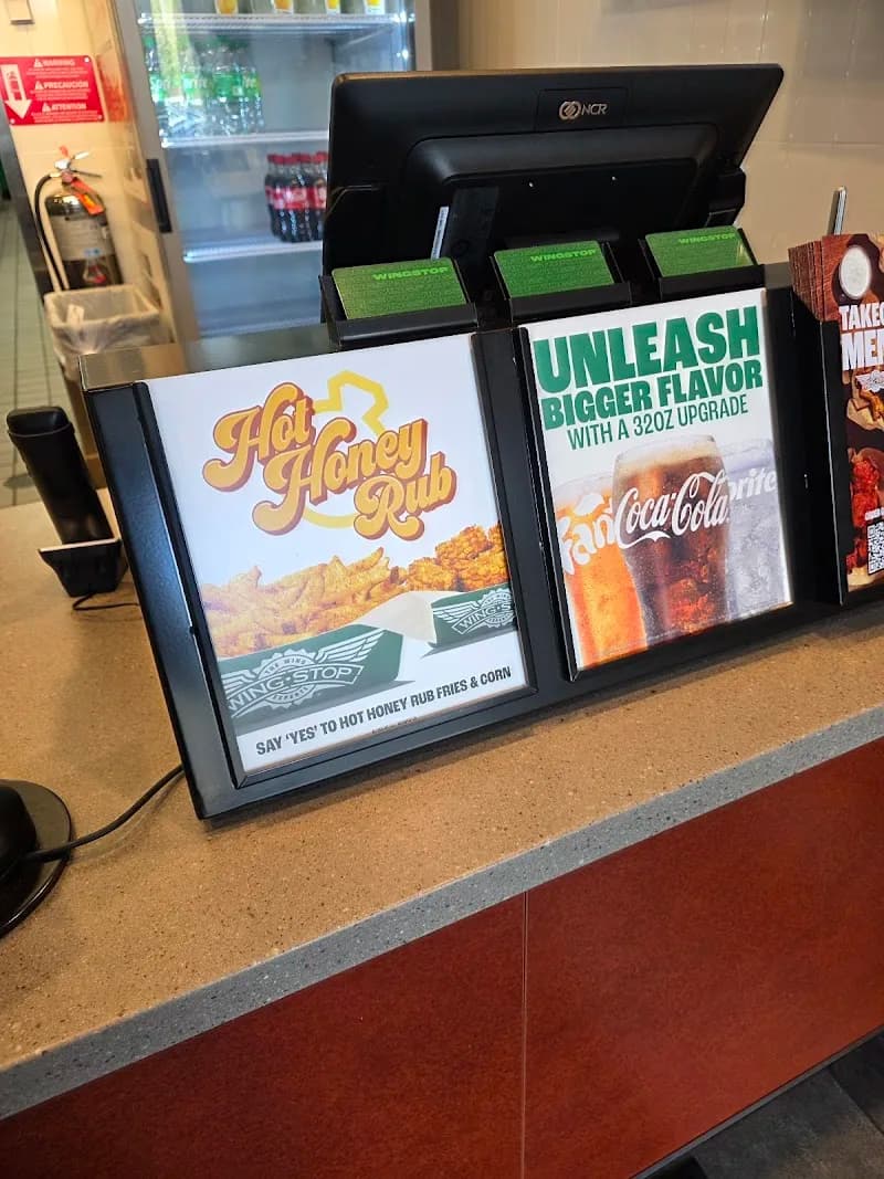 Wingstop storefront outside and inside view at 5777 NW 7th St. in Miami, Florida