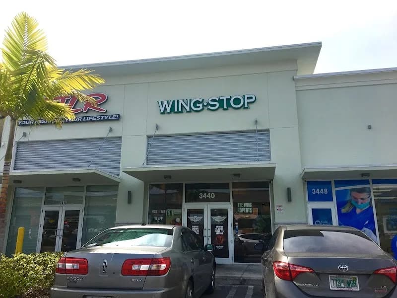 Wingstop storefront outside and inside view at 3440 NW 79th St. in Miami, Florida