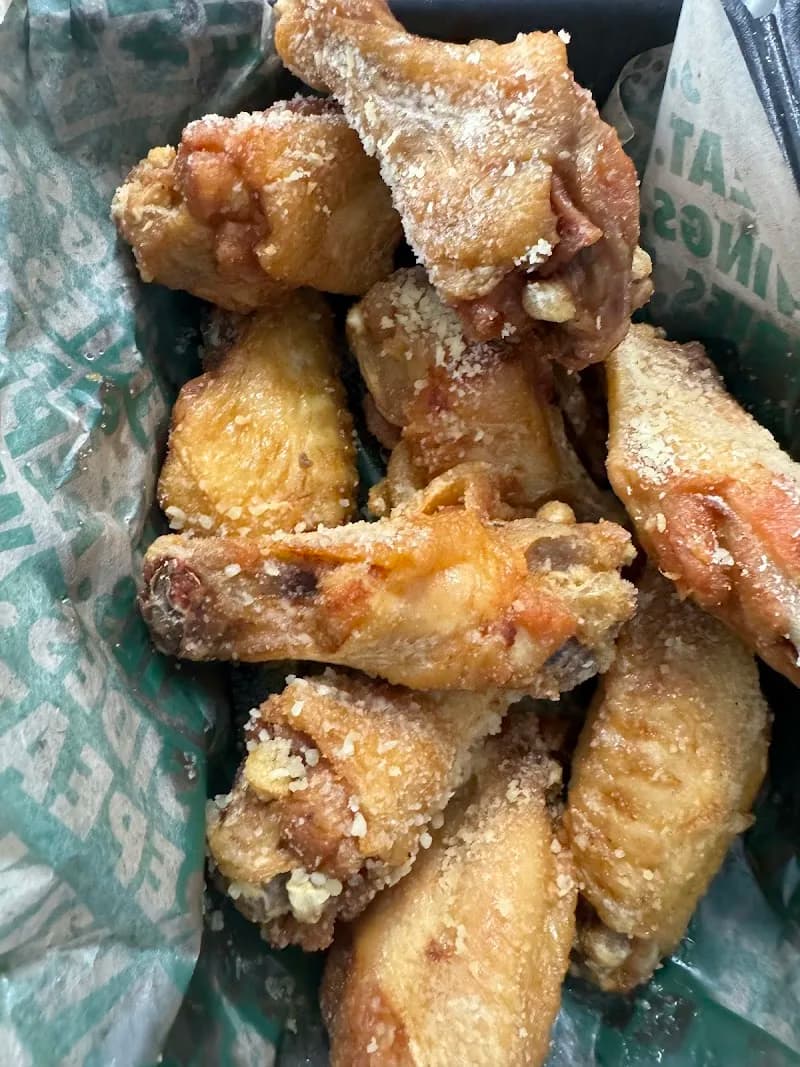 Wingstop storefront outside and inside view at 12528 Sw 120Th St in Miami, Florida