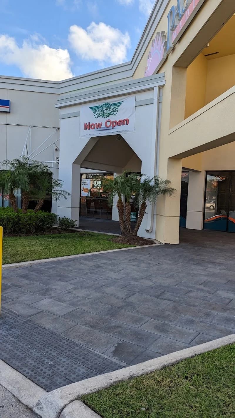 Wingstop storefront outside and inside view at 14802 N. Kendall Drive in Miami, Florida