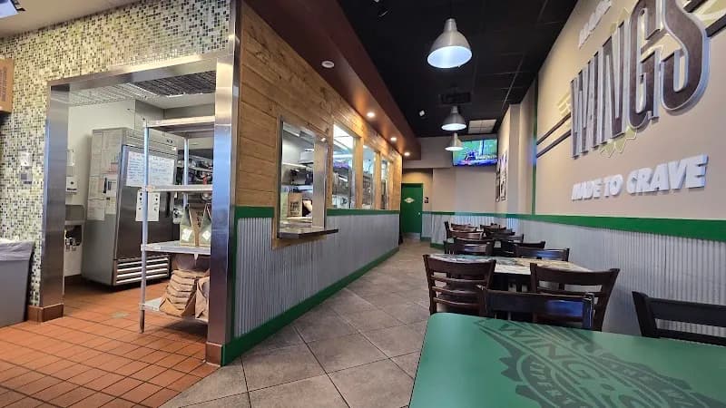 Wingstop storefront outside and inside view at 27004 S. Dixie Highway in Naranja, Florida