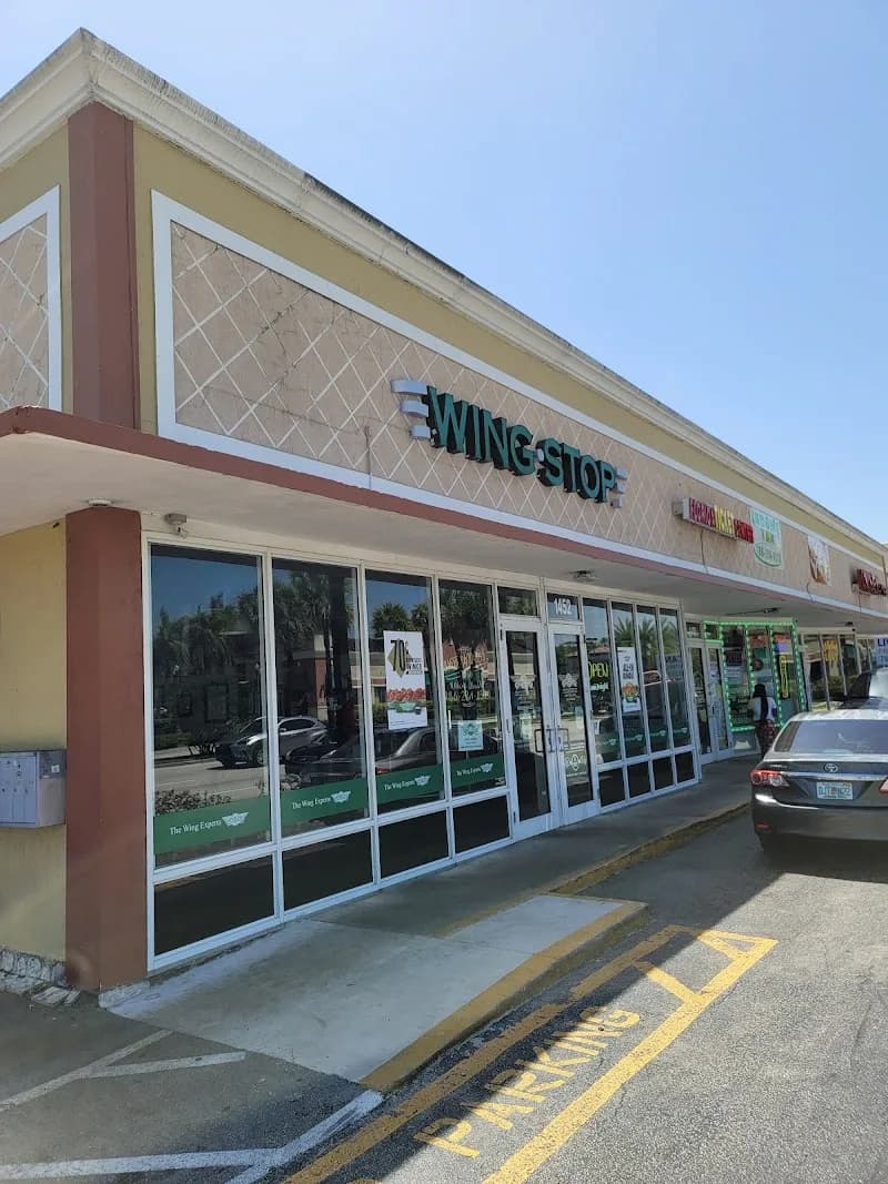 Wingstop storefront outside and inside view at 1452 Ne 163 St in North Miami Beach, Florida