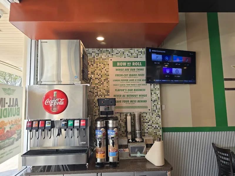 Wingstop storefront outside and inside view at 2499 Enterprise Road in Orange City, Florida