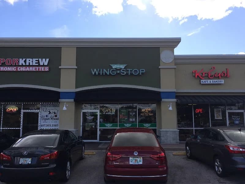 Wingstop storefront outside and inside view at 12014 East Colonial Drive in Orlando, Florida