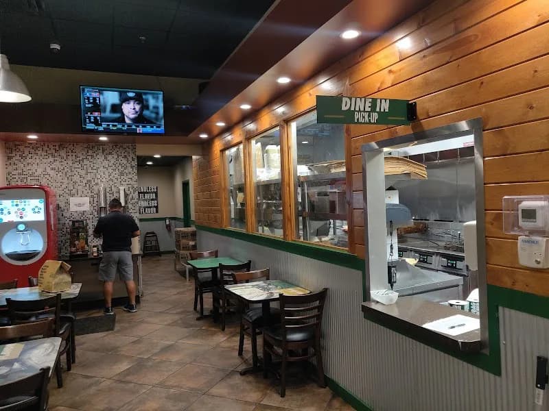Wingstop storefront outside and inside view at 8956 Turkey Lake Rd #300 in Orlando, Florida