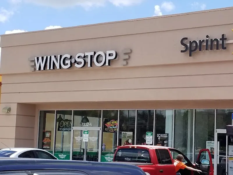 Wingstop storefront outside and inside view at 7332 West Colonial Dr in Orlando, Florida