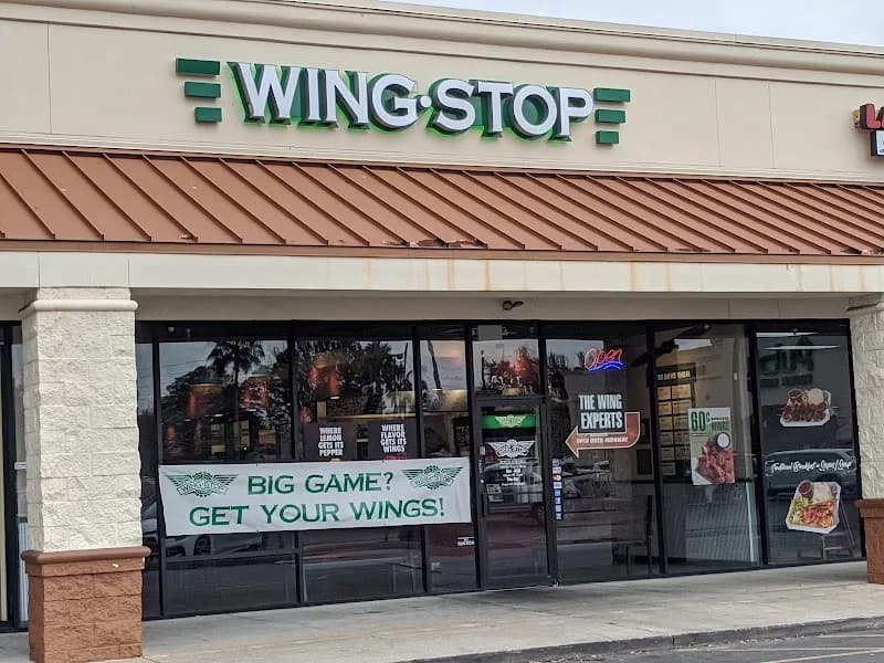 Wingstop storefront outside and inside view at 5131 S. John Young Pkwy in Orlando, Florida