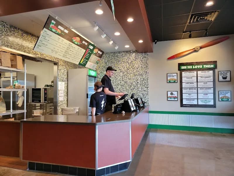 Wingstop storefront outside and inside view at 33148 Hwy 19 N in Palm Harbor, Florida