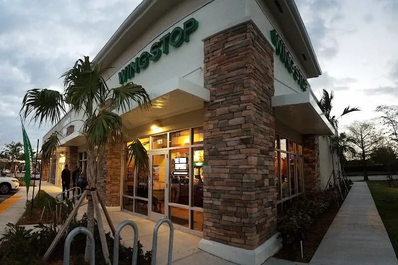 Wingstop storefront outside and inside view at 15999 Pines Blvd in Pembroke Pines, Florida