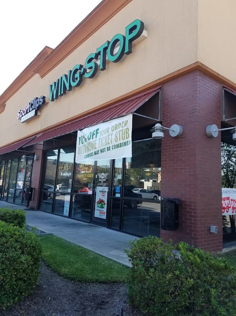 Wingstop storefront outside and inside view at 5147 Bayou Blvd in Pensacola, Florida