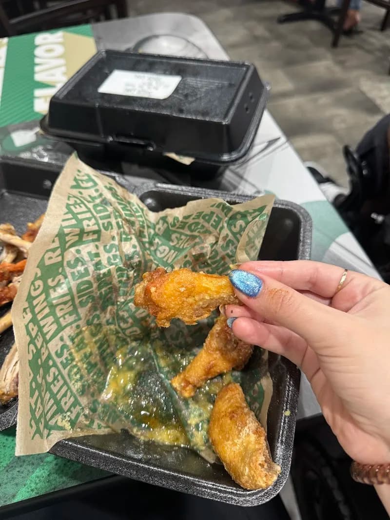 Wingstop storefront outside and inside view at 3821 S. Nova Rd in Port Orange, Florida