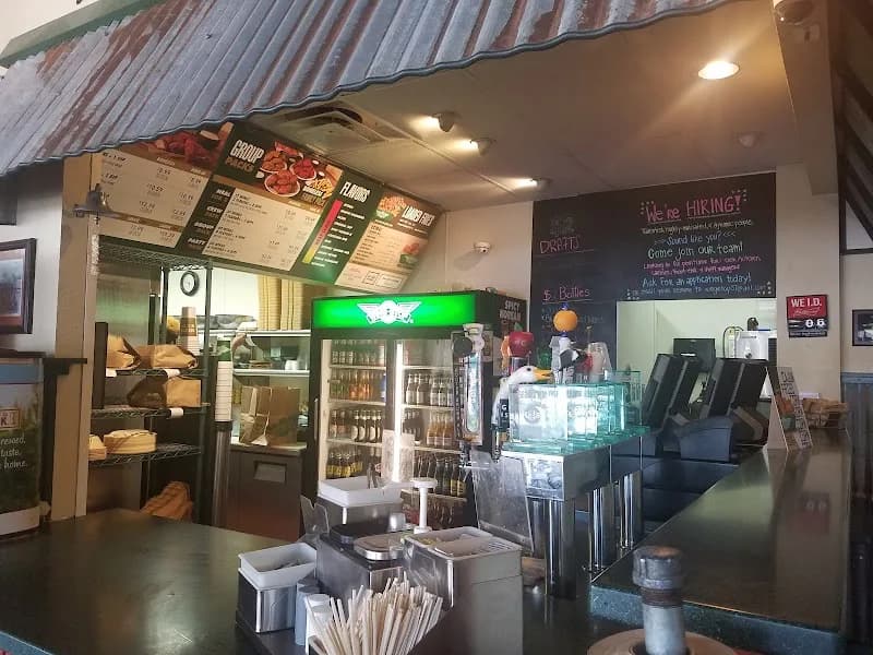 Wingstop storefront outside and inside view at 3111 Mahan Dr Ste 21 in Tallahassee, Florida