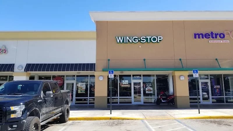Wingstop storefront outside and inside view at 5720 North University Drive in Tamarac, Florida