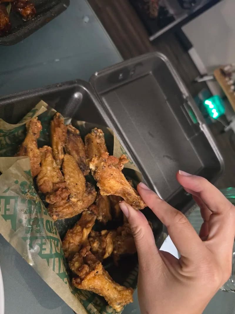 Wingstop storefront outside and inside view at 3611 W Hillsborough Ave in Tampa, Florida