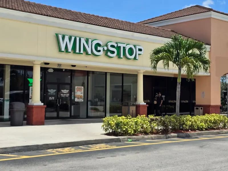 Wingstop storefront outside and inside view at 6901 Okeechobee Blvd in West Palm Beach, Florida