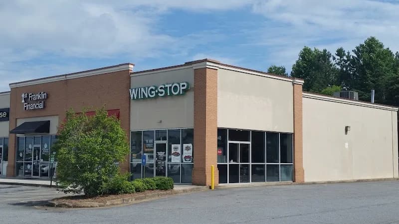 Wingstop storefront outside and inside view at 3265 Cobb Parkway N in Acworth, Georgia