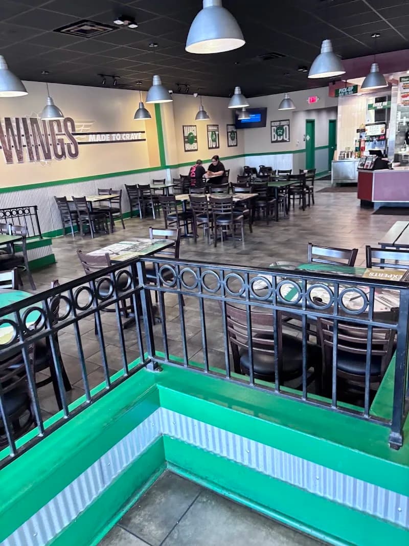 Wingstop storefront outside and inside view at 122 Alps Road in Athens, Georgia