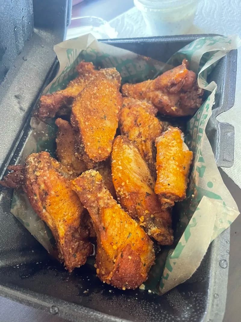 Wingstop storefront outside and inside view at 595 Piedmont Ave Ne Ste 330 in Atlanta, Georgia