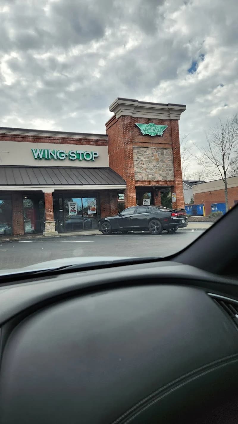 Wingstop storefront outside and inside view at 1715 Howell Mill Road in Atlanta, Georgia