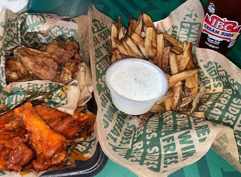Wingstop storefront outside and inside view at 1715 Howell Mill Road in Atlanta, Georgia