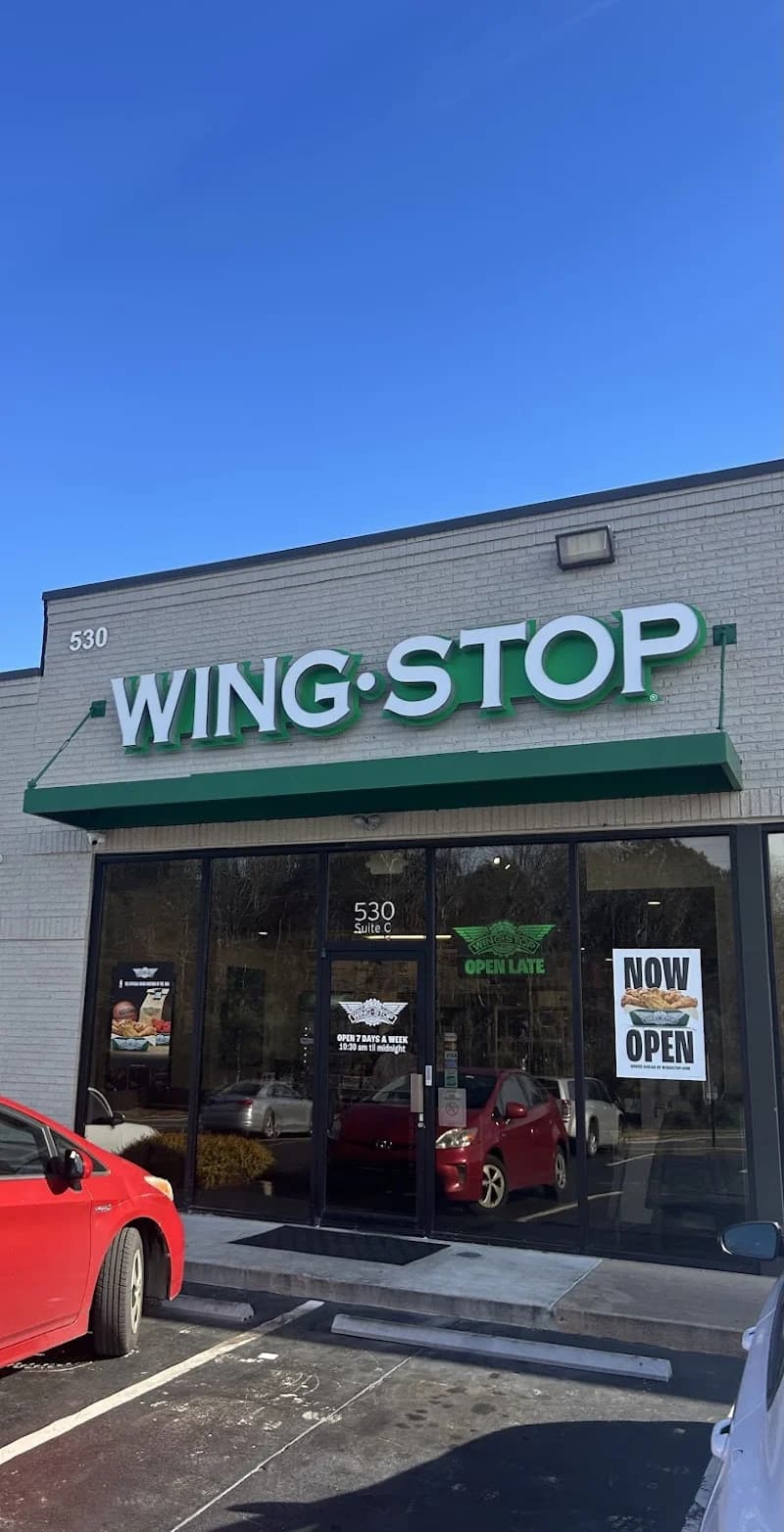 Wingstop storefront outside and inside view at 530 Lake Center Pkwy in Cumming, Georgia