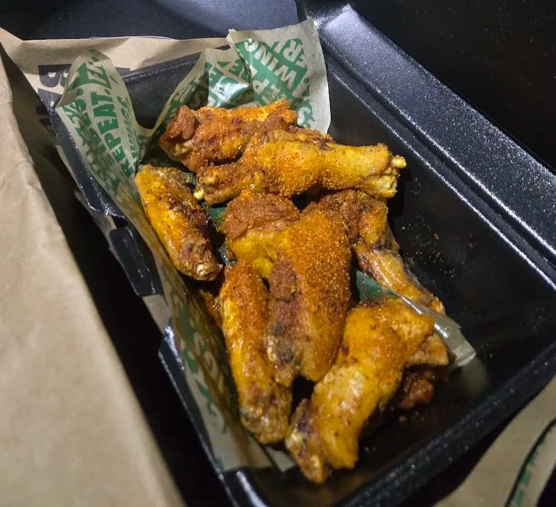 Wingstop storefront outside and inside view at 8651 Hiram Acworth Hwy 111 in Dallas, Georgia