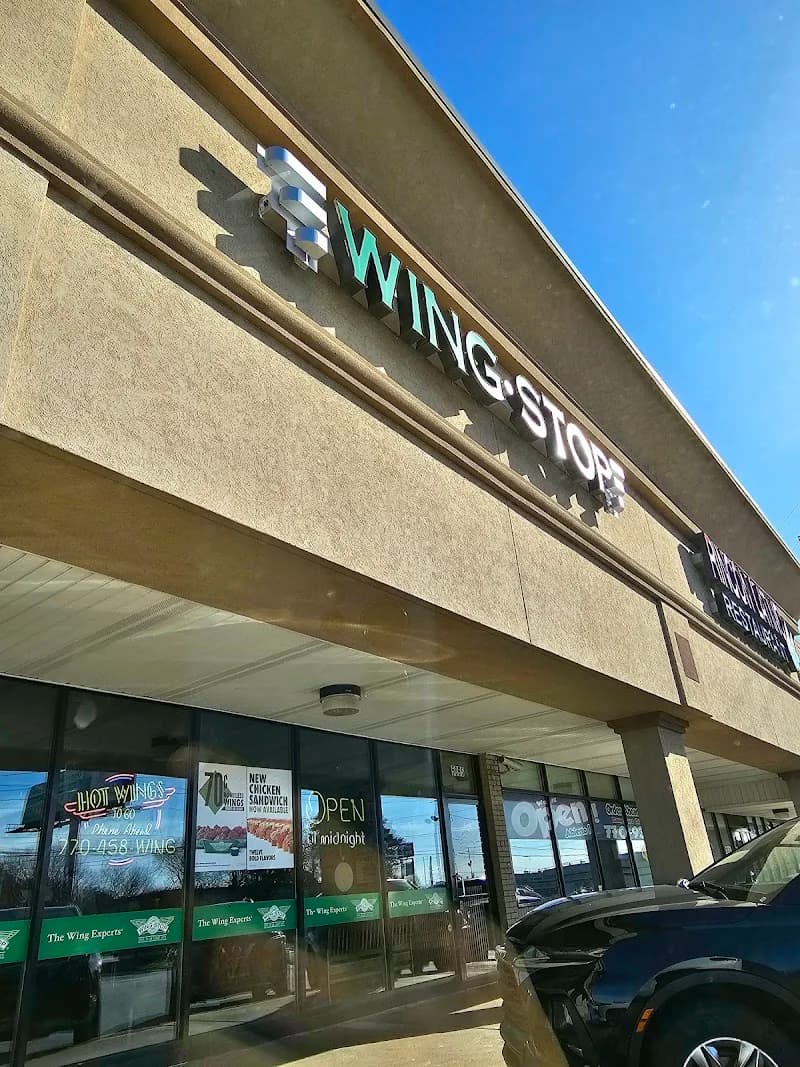 Wingstop storefront outside and inside view at 5065 Buford Hwy NE in Doraville, Georgia
