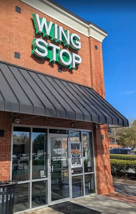 Wingstop storefront outside and inside view at 6575 Sugarloaf Parkway Ste 401 in Duluth, Georgia