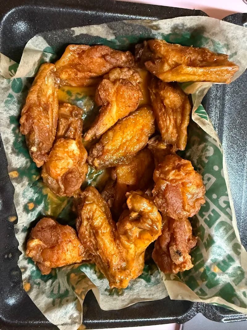 Wingstop storefront outside and inside view at 2570 Pleasant Hill Rd Ste 104 in Duluth, Georgia