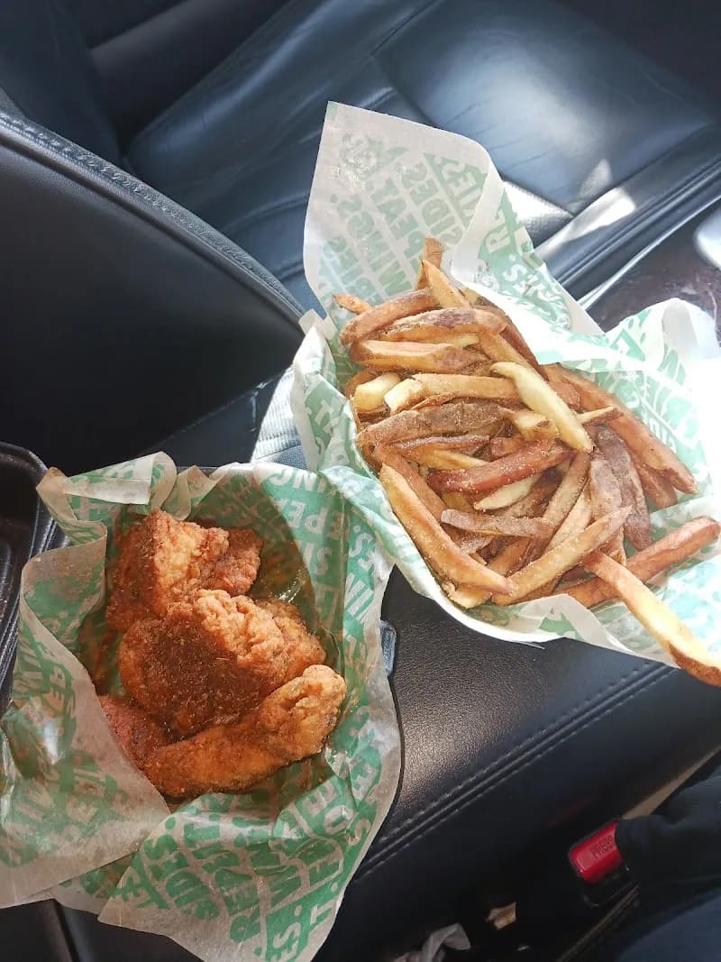 Wingstop storefront outside and inside view at 3630 Marketplace Blvd Suite 830 in East Point, Georgia
