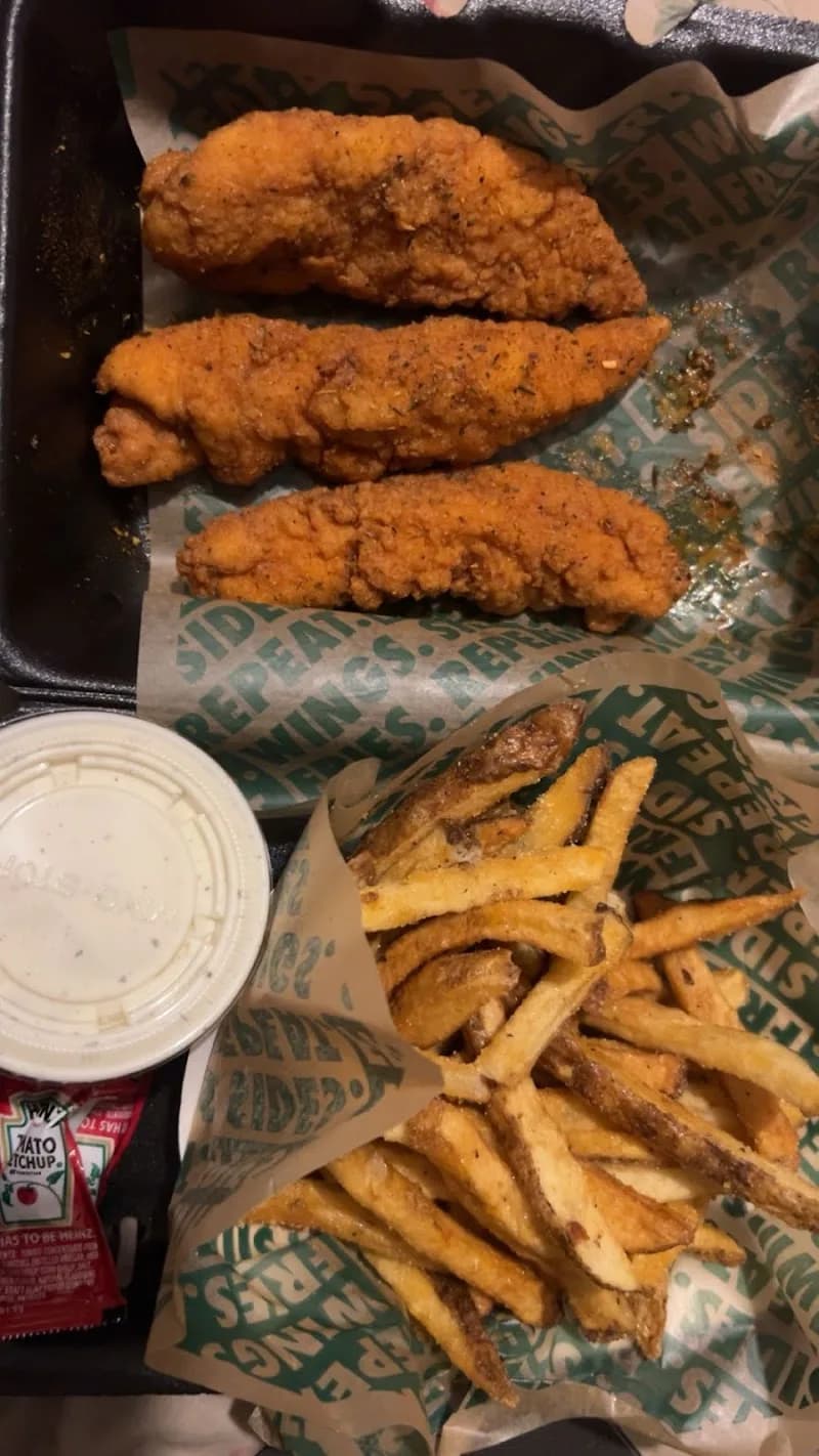 Wingstop storefront outside and inside view at 1351 Boone Ave in Kingsland, Georgia