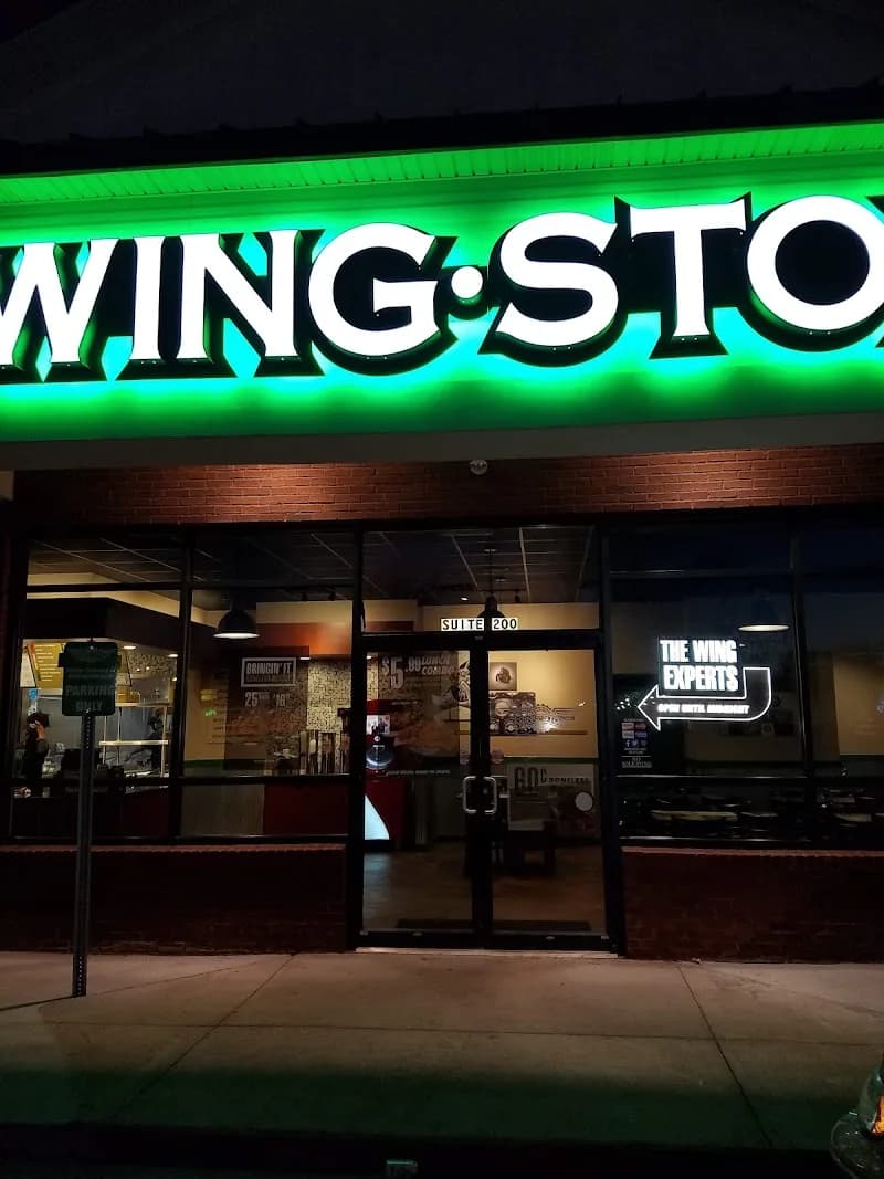 Wingstop storefront outside and inside view at 51 Cobb Pkwy S. in Marietta, Georgia