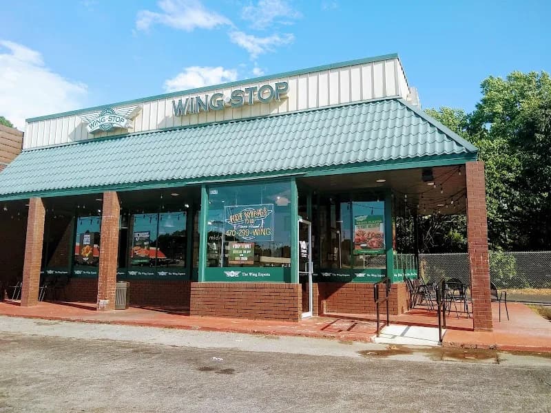 Wingstop storefront outside and inside view at 5247 Jimmy Carter Blvd. in Norcross, Georgia