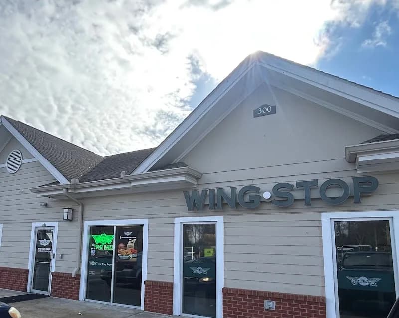 Wingstop storefront outside and inside view at 4715 S Atlanta Rd SE Ste 303 in Smyrna, Georgia